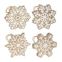 four wooden snowflakes are shown on a white background, one is cut out and the other is made from wood