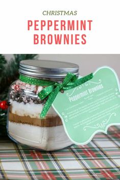 christmas peppermint brownies in a glass jar with a green ribbon around it