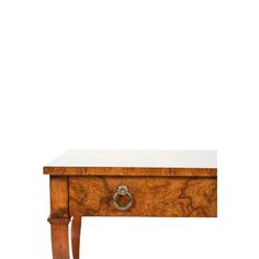 an old wooden table with a drawer on it's legs and a white marble top