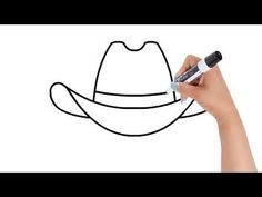 a hand drawing a cowboy hat on a whiteboard