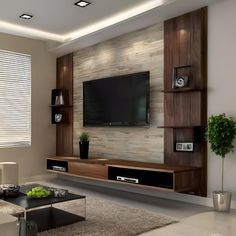 a living room with a large television mounted to the wall and shelves on each side