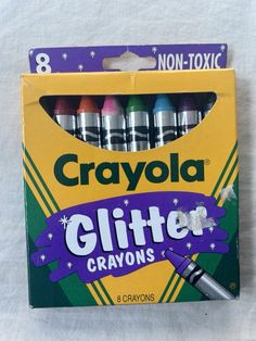 a box of crayola glitter crayons