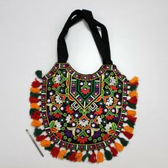 View Similar  My Store/Shop  Follow Us  Favorite US    Vintage Triabal Banjara Ethnic Designer Embroidered Fancy Fashionable Stylish Indian Handmade Multi Purpose Gypsy Boho Tibetan Bag. Dimension: 15 X 12 inches, 38.1 X 30.5 cm Weight: 0.2 kg, 0.441 lbs Item Code: F077 This is a Multi Purpose Designer Bag, Hand crafted softly by artisans in India. All Pockets in this bag are in good condition. The way in which the designs have been done makes the bag extraordinary. It has different beautiful designs and patterns which gives a distinct look. As these are handmade bags so they may have some slight imperfections however, there won't be any compromise in quality. The bag is handmade to create a unique product, one of a kind, thus it’s a perfect GIFT too. My Profile Check out my other listings Stylish Shoulder Bag, Designer Bag, Handmade Bags, Beautiful Design, Bags Handbags, Bags Designer, Hand Crafted, Shoe Accessories, Bag Lady