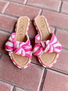 Introducing RACHAEL—a playful dance of style and comfort. These sandals showcase a delightful striped cotton canvas adorned with a charming bow, adding a touch of whimsy to your look. STYLE DETAILS: STRIPED COTTON CANVAS BOW SANDAL SLIP-ON FLAT SLIDE Adjustable Fabric Sandals For Summer, Trendy Fabric Sandals For Summer, Summer Fabric Sandals For Spring, Fabric Sandals For Vacation, Summer Bow Sandals For Beach, Adjustable Bow Sandals For Beach, Trendy Beach Sandals With Bow, Casual Summer Sandals With Bow, Cute Sandals For Beach Season Vacation