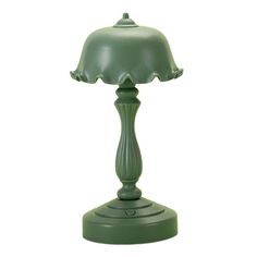 a green table lamp on a white background