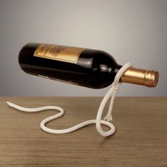 a wine bottle that is connected to a cord