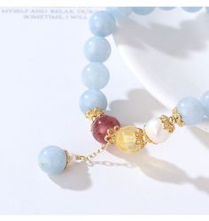 This elegant color stone bead bracelet features light blue aquamarine beads, 7 mm bead diameter, with a dangle drop bead, gold metal bead cap as an accent, on elastic band for easy fitness. Add this elegant bead bracelet to your everyday fashion jewelry collection or as gift for your love one. Jewelry Care: See more information about how to care for your jewelry here. Shipping Policy: Orders will be shipped within 1-3 business days. Economy shipping will take 7-14 days to arrive and standard shi Elegant Light Blue Jewelry With 8mm Beads, Elegant Aquamarine Beaded Bracelets, Easy Fitness, Metal Bead, Aquamarine Beads, Elegant Color, Drop Beads, For Your Love, Jewelry Photography