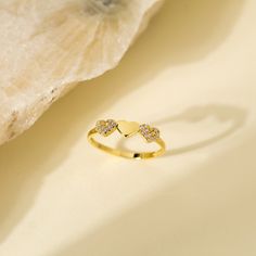 14K Solid Gold Stackable Minimalist Three Heart Ring with Cubic Zircon - Dainty Triple Hearth Band Ring for Anniversary Gift - Christmas Gift * PRODUCT FEATURES * ✔️Band Width: 1.70 mm ✔️Top Width: 4.54 mm x 16.57 mm ✔️Thickness: 1.30 mm ✔️Gemstone: AAA Grade White Cubic Zirconia Crafted from 14K solid gold, this stackable minimalist ring features three delicately designed hearts adorned with cubic zirconia. The dainty triple heart band creates an elegant and timeless piece, making it a perfect Gold Crystal Promise Ring For Valentine's Day, Gold Heart-shaped Promise Crystal Ring, Gold Heart-shaped Crystal Promise Ring, Heart-shaped Gold Crystal Promise Ring, Heart Band, Triple Heart, Fine Jewelery, Minimalist Ring, Gift Product