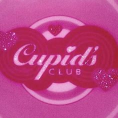 the cupid's club logo is displayed on a pink plate with glitter hearts