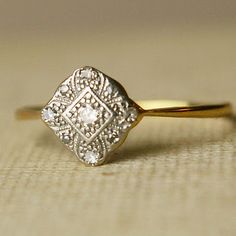 a diamond ring sitting on top of a table