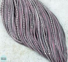 Wool DE dreads Gray pink dreadlock extensions Double ended dreads ⭐ handmade wool dreads ⭐ with x-wrap, braids and beads ⭐ cruelty-free ⭐ extrafine merino wool ⭐ toxic-free dying complies Length: 17-21 inch (43-55 cm) /when folded/ Thickness: 0,2 inch (0,5 cm) Gray / pink / white blended merino wool dreadlock extension with braided dreadlocks. Winter cosplayer hair accessories Full set double ended / single ended wool dreads Q U A N T I T Y For an accent -> 5-20 DE For a mohawk -> 30-40 DE Braids And Beads, Dread Styles, Braided Dreadlocks, Fake Dreads, Double Ended Dreads, Wool Dreads