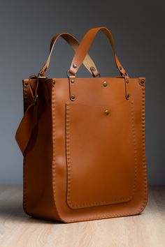 Our handcrafted bag is made from premium Italian leather in a warm ginger color - with a big love and passion! ❤️ ⚒ It features a magnet and adjustable strap, combining style and practicality.  ✔️The design allows it to be worn both on the shoulder and carried by hand, offering versatile carrying options for any occasion. Each bag from our store - is unique, making it a one-of-a-kind accessory. ⚒ About the Bag: *Size: 36x30x15 cm *Color: Ginger *Material: Italian Leather *Lock Type: Magnet World Big Hand Bag, Unique Leather Bag, Ginger Color, Woman Bag, Favorite Handbags, Handcrafted Bags, Cute Handbags, Produce Bags, Leather Handbags Women