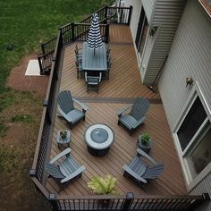 an overhead view of a deck with chairs and umbrellas on it's side