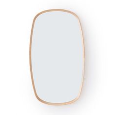 an oval wooden mirror on a white wall with light wood frame and bottom edge, in the shape of a rectangle