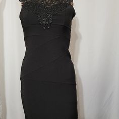 Iris Brand Lbd. Lace Halter Neck W/Tie In The Back Backless & Sleeveless Sexy Dress Laying Flat Measurements Are Pit To Pit 13" Pit To Bottom Heam 23" Long. Hand Wash Only Never Worn. From A Smoke Free Pet Free Environment. This One Won't Last Long! Black Lace Trim Bodycon Dress For Party, Black Lace Trim Bodycon Dress For Evening, Black Lace Trim Sheath Dress, Black Sheath Dress With Lace Trim, Black Bodycon Dress With Lace Trim For Evening, Chic Black Bodycon Dress With Lace Trim, Formal Black Mini Dress With Lace Trim, Black Formal Mini Dress With Lace Trim, Fitted Black Midi Dress With Lace Trim