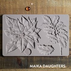 a cookie sheet with leaves and acorns on it, next to the words maka daughters