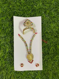 Beautiful Mukut with necklace and earrings set for our Krishna ji Available for Laddu Gopal in Size 3 and Size 4 Can be used for other deity idols Designer piece  Quality guaranteed  From land of Krishna, Mathura Festive Spiritual Multicolor Temple Necklace, Hand Set Temple Necklace For Puja Festivals, Multicolor Stone Work Necklace For Rituals, Spiritual Jewelry With Stone Work For Gift, Spiritual Jewelry Gift With Stone Work, Multicolor Hand Set Jewelry For Puja, Traditional Jewelry Sets For Puja And Navratri, Multicolor Temple Jewelry Earrings For Puja, Silver Jewelry Sets For Puja And Festivals