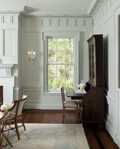 a living room filled with furniture and a fire place