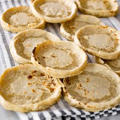 there are many small pies that are on the table together and ready to be eaten