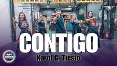 a group of people standing on top of a stage with the words contigo