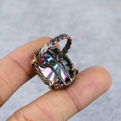 Rainbow Mystic Topaz Ring Copper Wire Wrapped Ring Copper Ring | Etsy Handmade Iridescent Mystical Ring, Handmade Mystical Iridescent Ring, Mystical Handmade Iridescent Ring, Handmade Magical Crystal Ring As Gift, Handmade Magical Crystal Ring For Gift, Handmade Adjustable Iridescent Crystal Ring, Iridescent Gemstone Jewelry With Magical Style, Mystical Adjustable Crystal Ring Gift, Adjustable Mystical Crystal Ring For A Gift