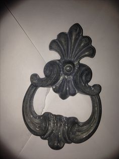 an old metal door handle on the wall