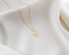 "* Cursive Initial Charm Letter Necklace *  Wear the initials of someone close to you and feel their presence always. Our dainty letter necklace in gold is a great option to subtly keep your loved ones close and works perfectly as a romantic gift for a birthday, anniversary or Christmas. Custom Script Letter Charm Necklace is perfect for layering for a personalized, elevated look. We offer 4 finish colors which are Silver, Gold, Rose and Black Can be used as a perfect gift for both women/girls, Gold Initial Necklace With Adjustable Chain For Mother's Day, Elegant Gold Name Necklace For Bridesmaid, Gold Initial Necklace With Clavicle Chain For Mother's Day, Yellow Gold Initial Necklace For Wedding, Yellow Gold Initial Necklace For Wedding And Mother's Day, Yellow Gold Initial Necklace For Wedding On Mother's Day, Elegant Gold Initial Necklace For Bridesmaids, Elegant Gold Initial Necklace For Wedding, Dainty Gold Name Necklace For Wedding