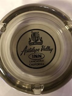 an ashtray is shown with the logo for antelope valley inn in lancaster, california