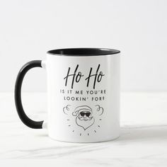 a black and white coffee mug with the words ho ho is it me you're looking for?