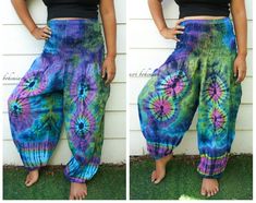 "💥One Size Fits Most Comfortable Unisex Tie Dye Harem Pants, Hippie Pants, Tie Dye Baggy Pants, Festival Harem Pants, Festival Clothing, Tye Dye Genie Pants, Tie Dye Comfy Pants 👉Fabric: Soft and Breathable Rayon 👉Smocked Elasticated Waist: 26\" up to 54\" 👉Hips up to: 60\" 👉Total Length: 45\" (Top to Bottom) 👉 Around elastic ankle 10\" 👉 Tie Dye Method 👉 One Size Fits S-XL or US 0-20 👉Extremely Comfortable 👉Boho/Hippie Theme, Beach Wear 👉2 Side Pockets Note: Due to the handmade natur Multicolor Harem Yoga Bottoms, Tie Dye Pants For Festival, Tie Dye Hippie Harem Pants For Festivals, Hippie Tie Dye Harem Pants For Festivals, Tie-dye Hippie Harem Pants For Festivals, Hippie Style Tie Dye Pants For Festival, Hippie Style Tie-dye Pants For Festival, Hippie Style Multicolor Harem Pants, Multicolor Harem Pants With Loosely Fitted Hips