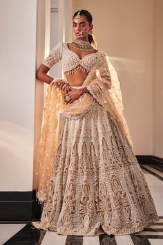 Peach organza lehenga with an attached cancan featuring floral and palace pattern heavy hand embroidery. Comes with matching embroidered padded blouse and dupatta. - Aza Fashions Fitted Lehenga With Lace Work For Designer Wear, Bollywood Style Fitted Lehenga With Lace Work, Fitted Lehenga With Lace Work For Festive Occasions, Fitted Lace Work Lehenga For Festive Occasions, Fitted Lehenga With Lace Work For Diwali, Traditional Fitted Lehenga With Lace Work, Fitted Lehenga With Lace Work In Traditional Drape, Wedding Lehenga With Lace Work For Diwali, Fitted Wedding Lehenga With Lace Work