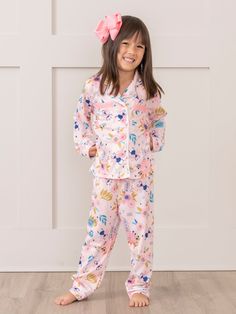 Get ready for a sweet slumber with our Pink Garden Pajamas! These girls pajamas feature playful dragonflies and whimsical florals, all in a charming shade of pink. Perfect for any little dreamer to snuggle up in style. Fits true to size. 95% Polyester / 5% Spandex Accessories sold separately. Suggest bow color #1 & #31 Import. Emi is 39 inches tall and 36 lbs wearing size L (4YRS). *Afterpay and Sezzle Purchase Requires $35 Minimum Order. Whimsical Florals, Playful Pink Cotton Sleepwear, Unicorn Pajamas Kids, Kids Pajamas Girls, Unicorn Kid Pajamas, Pink Unicorn Print Sleepwear, Pink Garden, Girls Pajamas, These Girls