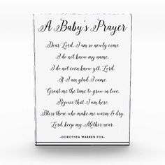 a baby's prayer card with black ink