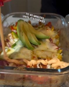 a plastic container filled with food on top of a table