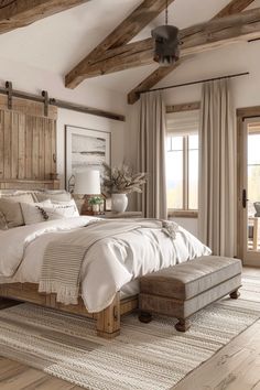 a large bed sitting inside of a bedroom on top of a wooden floor