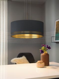 The Esteperra three light hanging pendant features a circular ceiling plate in a black finish, holding a drum shaped, black decorative fabric shade with gold lining. This stunning design will be a striking display for modern or contemporary decors. The pendant also features a gold design around the black exterior of the shade. The black hanging cord is fully adjustable for various hanging positions. EGLO Esteperra 3-Light Black Transitional Drum Medium Hanging Pendant Light | 99274A Lounge Lighting, 3 Light Chandelier, Gold Interior, 3 Light Pendant, Drum Chandelier, Dimmable Lamp, Black Pendant Light, Ceiling Rose, Black Lamps