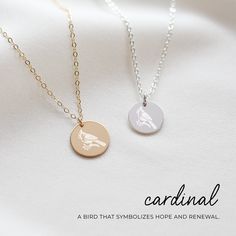 This necklace features a cardinal, a bird that symbolizes hope and renewal. It's a beautiful way to remember loved ones, reminding us that they're always with us in spirit. Just like the cardinal returns each season, it symbolizes the enduring presence and love of those we miss. Wearing this necklace is a tribute to their memory, a sign that love never fades and keeps us connected through time. Personalize the necklace with an optional engraving on the back.  Features: - Premium flat cable chain Remembrance Necklaces, Sophisticated Jewelry, Cardinal Bird, Cardinal Birds, Bird Charm, Gold Disc, Memorial Jewelry, Charm Gift, Jewelry Necklace