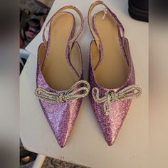 Slingbacks With Pointed Toes, A Decorative Rhinestone-Chain Bow At Front, And A Narrow Ankle Strap. Satin Lining. Heel Height 1/2 In. Heel Height: No Heel Footwear Type: Slingbacks Description: Purple, Solid-Color Imported: Yes Purple Slingback Pumps For Party, Silver Rhinestone Slingback Pumps For Party, Glamorous Silver Slingback Pumps For Prom, H&m Heels For Spring Party, Elegant H&m Heels For Formal Occasions, H&m High Heel Party Heels, H&m Shoes, Rhinestone Chain, Slingbacks