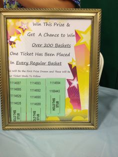 a person holding up a prize certificate for $ 20, 000 in every regular basket