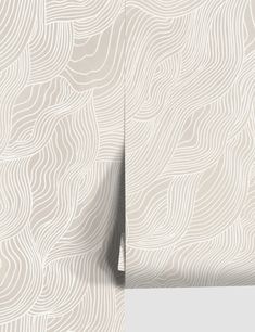 a white wallpaper with wavy lines on it