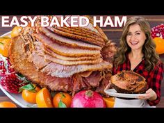 a woman holding a plate full of food with the words easy baked ham on it