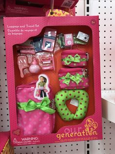 a barbie doll in a pink box with green bow ties and accessories on it's display shelf