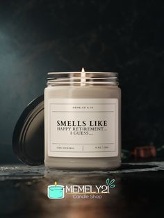 a candle is sitting on a table with the words smells like happy retirement in front of it