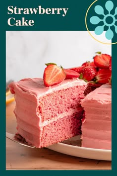 a strawberry cake with pink frosting and sliced strawberries