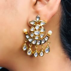 These are a beautiful pair of Earrings, made with beautifully Kundan beaded. These earrings work well with all types of clothing, whether it be formal attire or a casual party. Option 1 : Red Color (E718) Option 2 : White Color (E719) Eye-catching and unique jewellery that will set you apart. Gift this piece to a loved one, and see their face light up with joy. Best for gifting or for personal use, wear it to any occasion and be in the spotlight. Types Of Clothing, Saree Jewellery, Silver Pooja Items, Glass Bangles, Silver Toe Rings, Gold Chain With Pendant, Ruby Beads, Kundan Earrings, Face Light