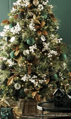 a christmas tree decorated with green and gold ornaments