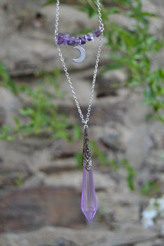 PLEASE read my shop announcement before placing an order so you know what to expect right now. Plus, when ordering from outside Europe, don't forget to provide a phone number for the courier to ensure the fastest and smoothest delivery. Statement boho witchy layered necklace featuring an amethyst beaded bar with dainty steel crescent moon, and a mystical amethyst color crystal pendulum. This is a short layered necklace, shortest layer with the amethyst beads and the moon is almost choker style, Mystical Sterling Silver Crystal Necklace With Moon Charm, Mystical Purple Necklace For Festivals, Spiritual Sterling Silver Crystal Necklace With Moon Charm, Mystical Silver Amethyst Necklaces, Spiritual Dangle Necklaces With Moon Charm, Bohemian Silver Crystal Necklace With Moon Charm, Bohemian Sterling Silver Crystal Necklaces, Purple Pendant Jewelry For Festival, Adjustable Bohemian Crystal Necklaces In Sterling Silver