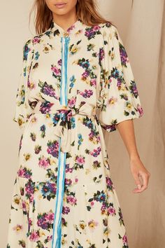 Bohemian Traders Drop Waist Midi Dress is beautifully patterned with vintage florals. Made from breathable rayon, it has dolman sleeves and a contrast sash that cinches the shape. Match your accessories to one of the colors in the print.