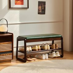 there is a shoe rack with many pairs of shoes on it next to a dresser