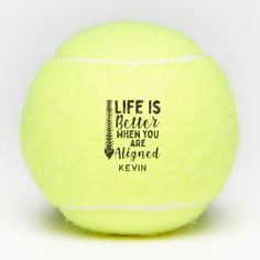 a yellow tennis ball with the words life is better when you are aligned on it